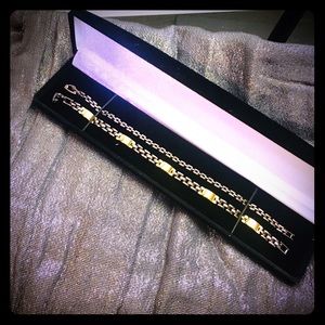 Dark metal, golden plated paired bracelets